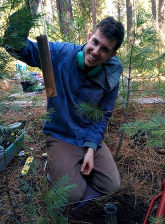 Nicholas Dove with a soil core sampled during his study.