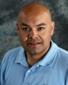 Public health professor Ricardo Cisneros wearing blue shirt